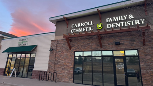 Exterior of Carroll Family & Cosmetic Dentistry dental office in Erie at sunset