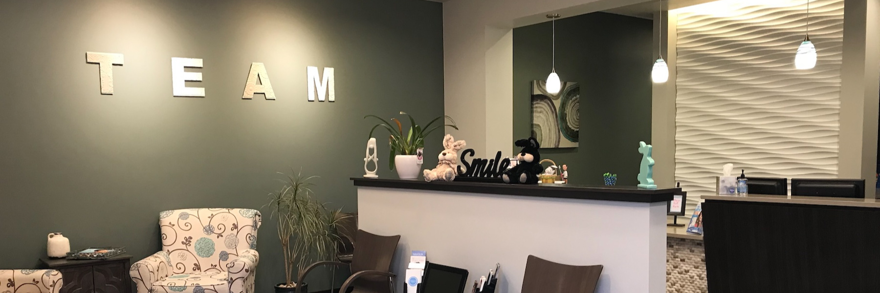 front desk and waiting room at Carroll Family & Cosmetic Dentistry in Erire near Broomfield